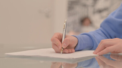 Close up of Young Woman Hand Writing a Letter