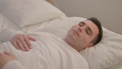 Young Man Waking Up and Leaving Bed