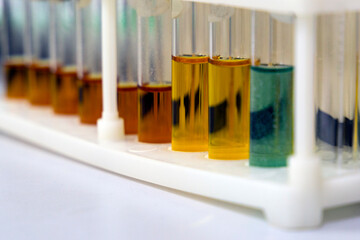 Test tubes with multi-colored reagent analysis. Colorimetry experiment in the laboratory