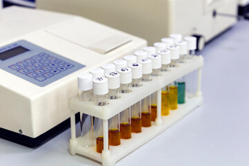 Test tubes with multi-colored reagent analysis. Colorimetry experiment in the laboratory