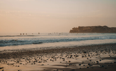 Sunset over Devil's Rock at Surfer Point in Tamraght, Morocco
