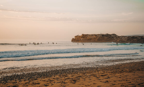 Sunset over Devil's Rock at Surfer Point in Tamraght, Morocco