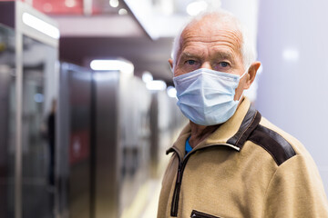 Fototapeta na wymiar Old man in subway station