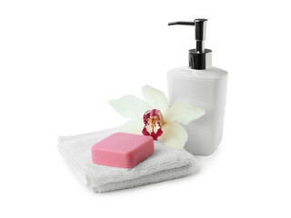 Obraz na płótnie Canvas Soap bar, dispenser and terry towel on white background