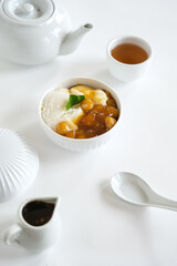 bubur sumsum is Indonesian traditional sweet dessert made by cooking rice flour in coconut milk and served with palm sugar. There is also a variety served with potato dumpling or biji salak.