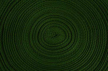 Background of green ribbon wound in a circle. View from above