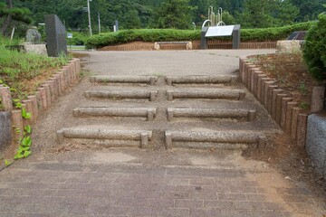 Four small steps leading to the plaza on Koiji Beach
