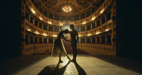 Cinematic shot of Young Couple of Classical Ballet Dancers Performing on the Stage of Classic...