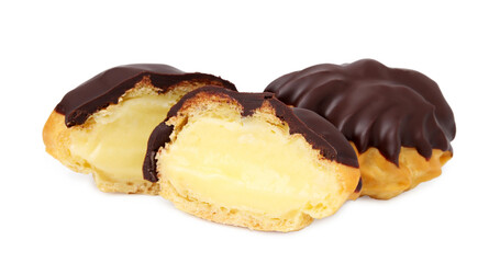 Delicious profiteroles with chocolate spread and cream isolated on white