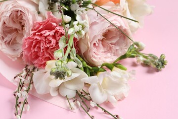 Bouquet of beautiful flowers on pink background, closeup