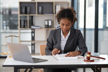 Lawyers Asiawoman   having through online Concepts  of Legal services at the law office.