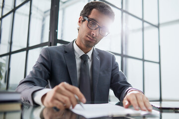 executive ceo manager writing notes in notebook at workplace.