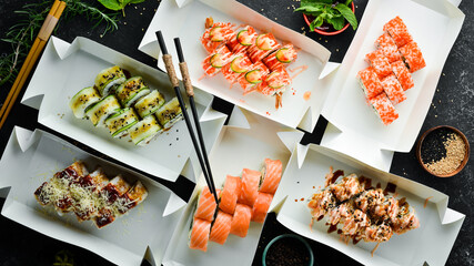 Japanese food. Set of sushi rolls with caviar, fish and shrimp. Food delivery. Free space for text.