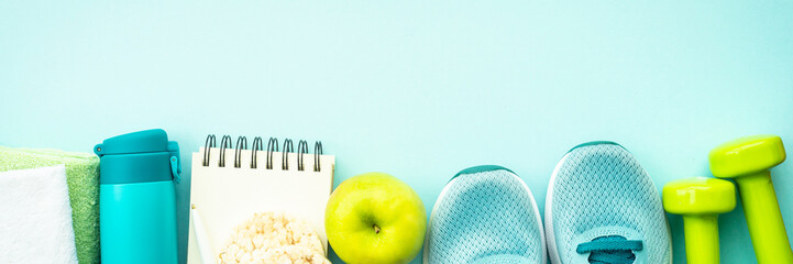 Fitness, workout, healthy lifestyle and clean eating concept. Long banner format on blue.