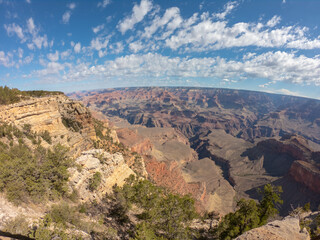 Fototapeta na wymiar The South Rim of the Grand Canyon National Park, carved by the Colorado River in Arizona, USA. Amazing natural geological formation. The Mather Point.