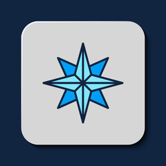 Filled outline Wind rose icon isolated on blue background. Compass icon for travel. Navigation design. Vector