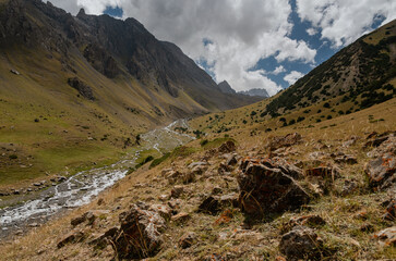 View of the peaks of the Turkestan Range across the beautiful valley of the Kashka-suu River in Kyrgyzstan.
