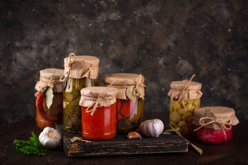 Pickled vegetables in glass jars.