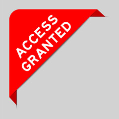 Red color of corner label banner with word access granted on gray background