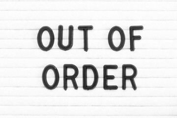 Black color letter in word out of order on white felt board background