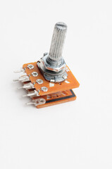 Variable resistor, potentiometer on white background