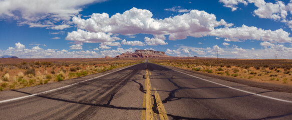 State Route 98 in Coconino County of northern Arizona, USA. Empty desert road with the LeChee Rock in the background.