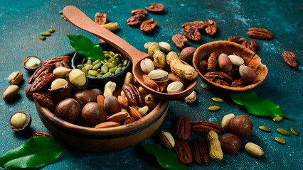 Macro photo. Background of various nuts (almond, cashew, hazelnut, pistachio, walnut). Vegetarian...