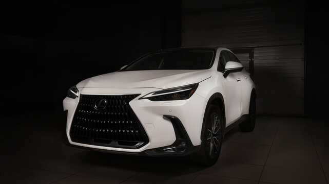 Warsaw, Poland - April 06, 2023: The new Lexus NX 350 F-Sport crossover is white, parked in the garage