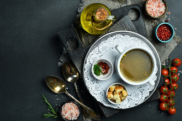 Fototapeta na wymiar Mushroom soup. Traditional Ukrainian cuisine. Close-up, dark background.