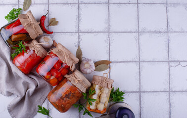 Pickled vegetables in glass jars.