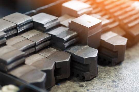 Metal blanks for manufacture of parts on lathe are on table. Close-up..