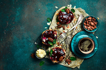 Chocolate Cherry Brownie and a cup of coffee. Dessert, sweets. On a stone background.