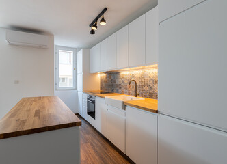 New modern kitchen. New home. Interior photography. Wooden floor.