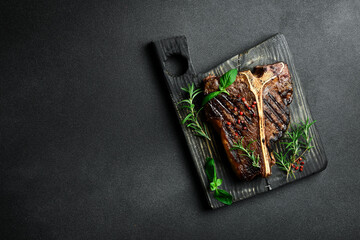 The T-bone or porterhouse steak of beef cut from the short loin. steaksT-shaped bone with meat on...