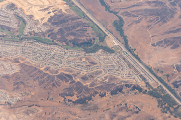 Aerial view of planned communities, construction, highways and subdivisions in the desert outside of Los Angeles in Southern California