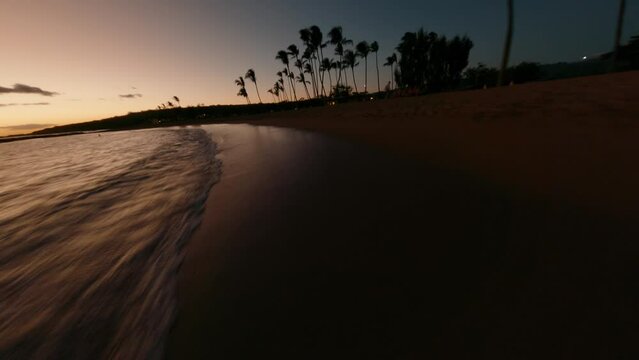 Sunset FPV Drone at Hawaiian Beach.  Filmed at Poipu Beach on Kauai, Hawaii. Beautiful sunset 