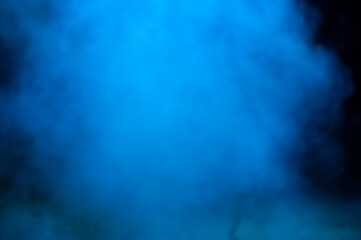 A foggy blue cloud of smoke at night