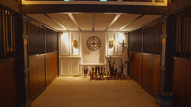 An elite stable, an inside look at the horse stalls, a beautiful and refined entourage. No animals, perfect room.