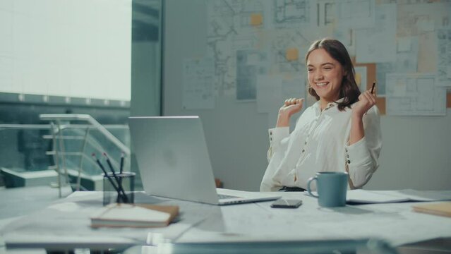 Confident Female Engineer is Typing on a Laptop Computer, Working Online on a New Project. Motivated Female Manager is Doing a New Project. Engineering and Creativity New Product Development