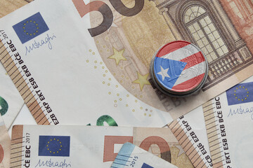 euro coin with national flag of puerto rico on the euro money banknotes background