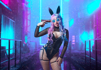  sexy bunny girl in ears with pink-blue hair and in a latex bodysuit and a gun to her temple.