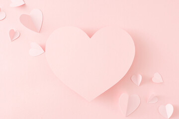Mother's Day concept. Top view photo of pink origami paper hearts on isolated pastel pink background with blank space. Valentines day celebration idea