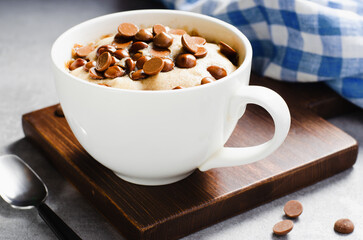 Peanut Butter and Chocolate Chips Mug Cake, Homemade Cake Cooked in the Microwave