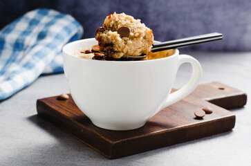 Peanut Butter and Chocolate Chips Mug Cake, Homemade Cake Cooked in the Microwave