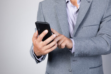 phone.men hand holding texting using mobile on sofa at home