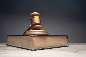 Judge gavel and law books in court, law and justice background