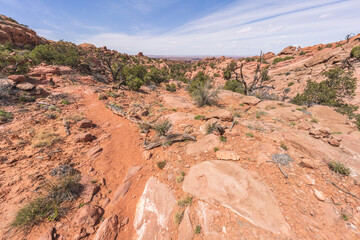hiking the syncline loop trail in island in the sky district of canyonlands national park, utah, usa
