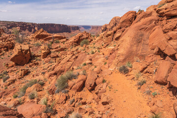 hiking the syncline loop trail in island in the sky district of canyonlands national park, utah, usa