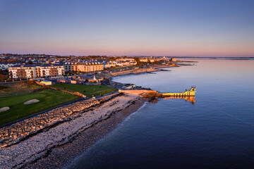 Popular Blackrock diving board and Salthill area of Galway city, Ireland. Popular city landmark and water sport area. Tourist attraction with high end hotels and amusement park.