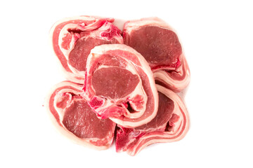 Stack of raw lamb chops on white background. Meat product of high quality and value. Food supply business.